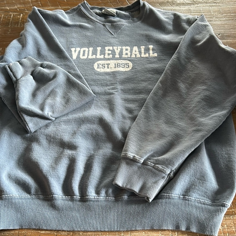 Port and Company faded blue volleyball crewneck sweatshirt.